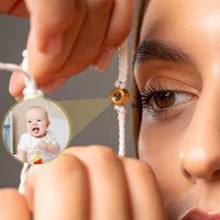 Thumbnail for White Photo Bracelet with a personalized photo of a smiling baby on a woman's wrist, by Brother & Sisters.