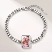 Thumbnail for Secret Cushion Photo Bracelet in silver, cushion-cut charm on a curb chain showing a family photo revealed by warmth | SKU: TPH-CUSB-SILVER