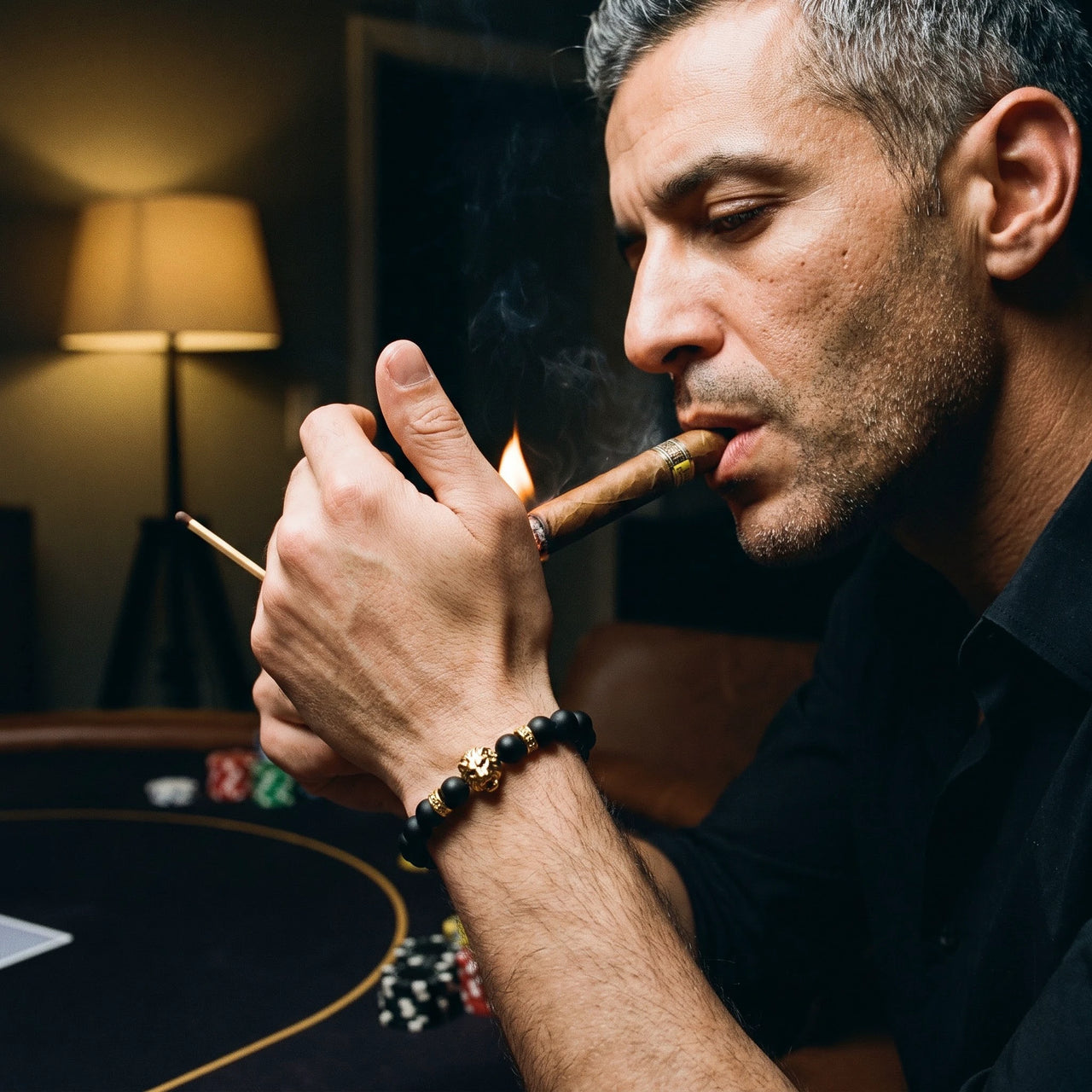 Gold Lion & Black Stones Bracelet – worn while lighting a cigar | Brother & Sisters | SKU: 20712286-gold-XS-14-15, 20712286-gold-S-16-17, 20712286-gold-M-18-19, 20712286-gold-L-20-21, 20712286-gold-XL-22-23