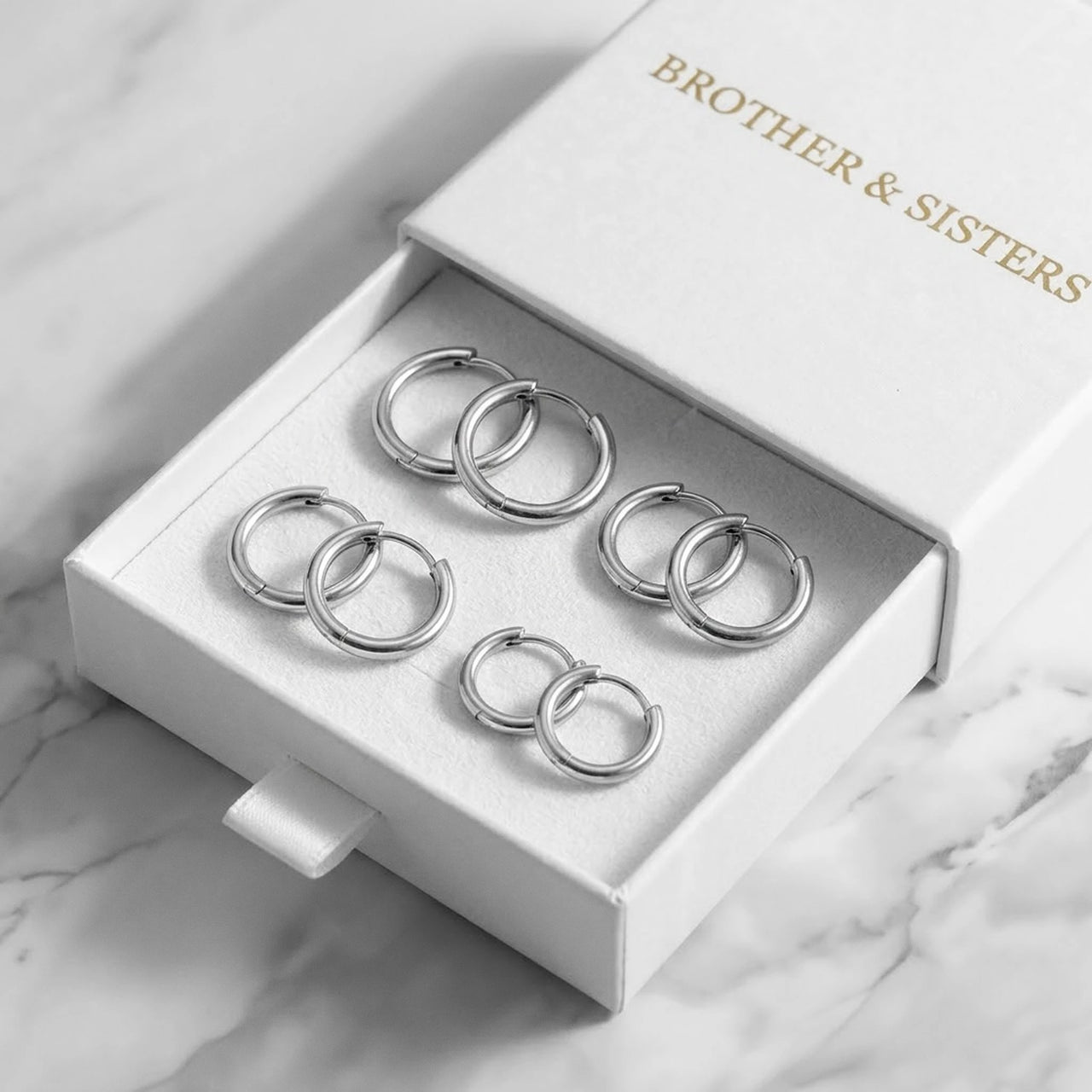 Huggie Hoop Earrings Set of 4 Pairs in Silver in the Brother & Sisters gift box | SKU: huggie-set-silver
